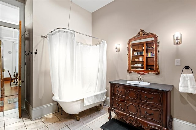 bathroom featuring tile patterned flooring, vanity, and walk in shower