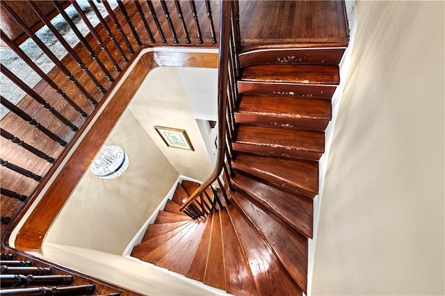 staircase featuring wood-type flooring