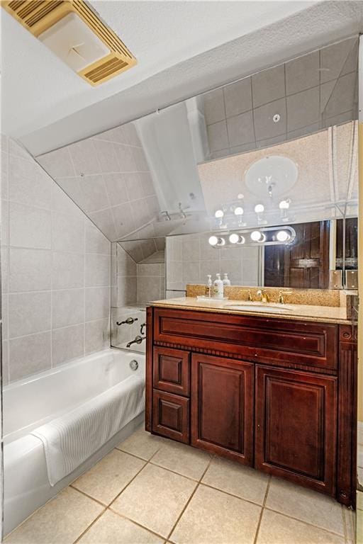 bathroom featuring vanity, tile patterned floors, and tile walls