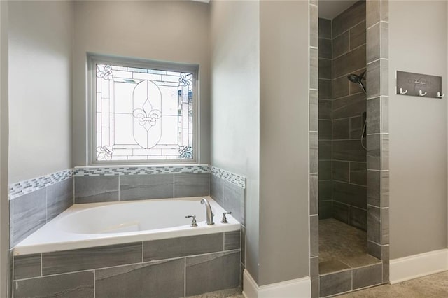 bathroom featuring separate shower and tub and tile patterned floors