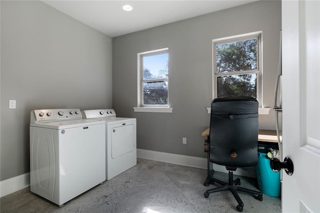 laundry room with independent washer and dryer and a wealth of natural light