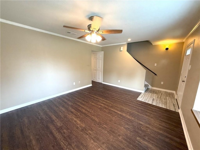 unfurnished living room with dark hardwood / wood-style floors, ceiling fan, and crown molding