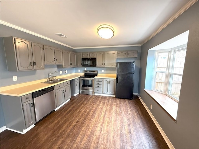 kitchen featuring ornamental molding, gray cabinetry, dark wood-type flooring, sink, and black appliances