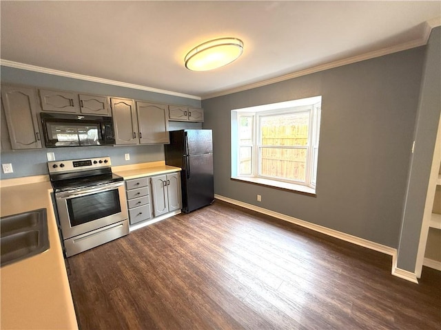 kitchen with ornamental molding, sink, dark wood-type flooring, and black appliances