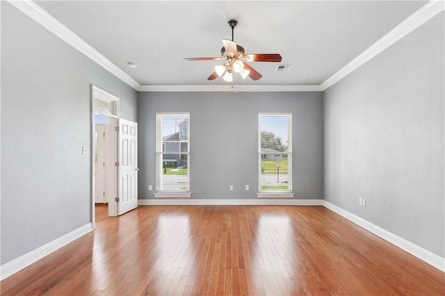 unfurnished room with light hardwood / wood-style flooring, ceiling fan, and crown molding