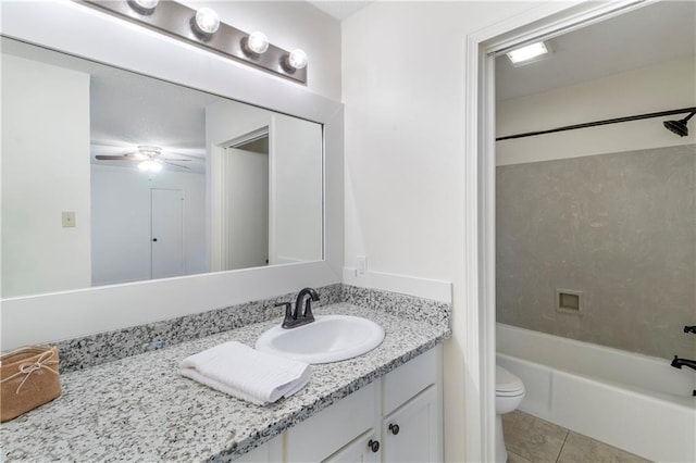 full bathroom with vanity,  shower combination, ceiling fan, tile patterned flooring, and toilet