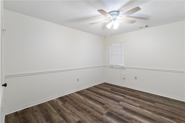 unfurnished room featuring a textured ceiling, ceiling fan, and dark hardwood / wood-style floors