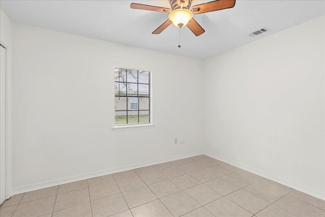 unfurnished room featuring ceiling fan and light tile patterned floors