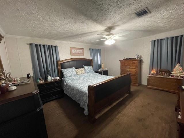 carpeted bedroom with ceiling fan, a textured ceiling, and visible vents