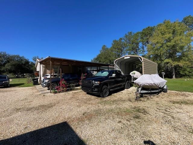 view of parking with a carport