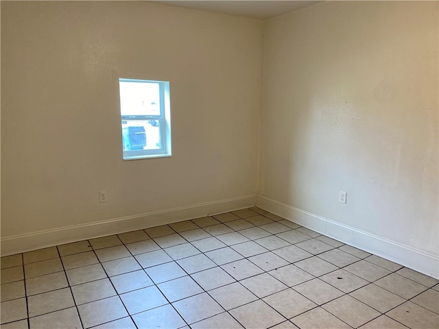 unfurnished room featuring light tile patterned floors