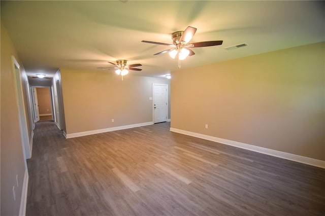 spare room with dark wood-type flooring