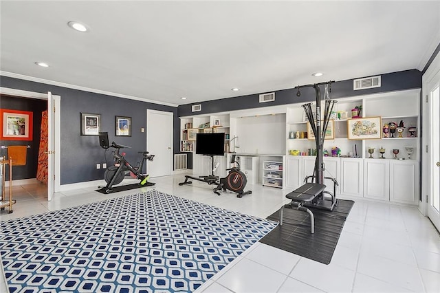 exercise room with ornamental molding and light tile patterned flooring