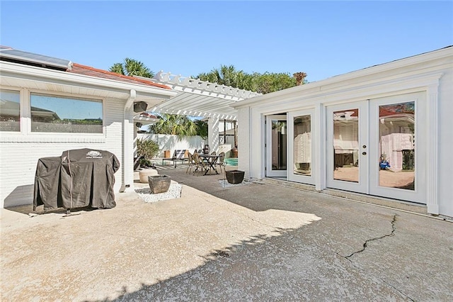 view of patio featuring french doors, a pergola, and area for grilling