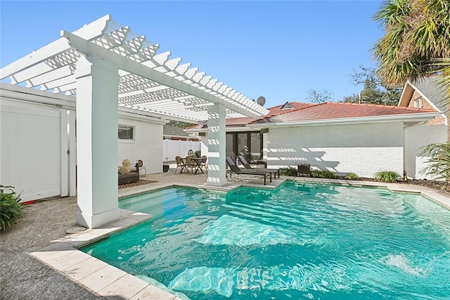 view of swimming pool featuring a patio area and a pergola