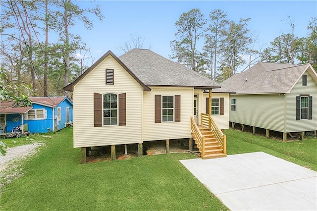 back of house with a lawn