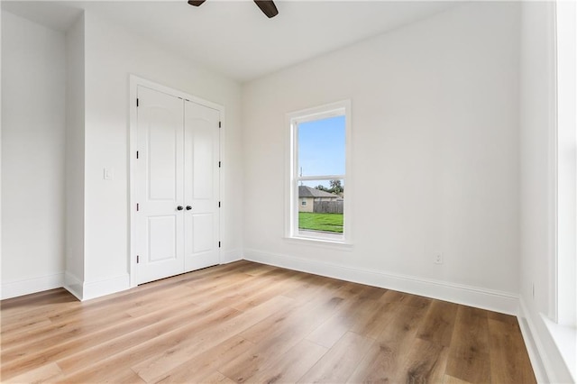 unfurnished bedroom featuring a closet, ceiling fan, and light hardwood / wood-style floors