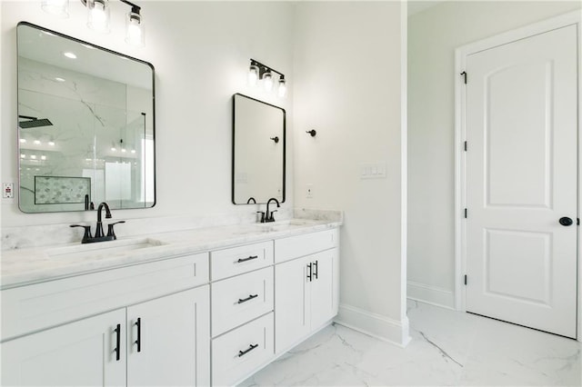 bathroom with vanity and tiled shower