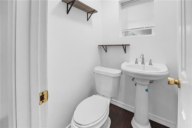 bathroom featuring toilet and hardwood / wood-style flooring