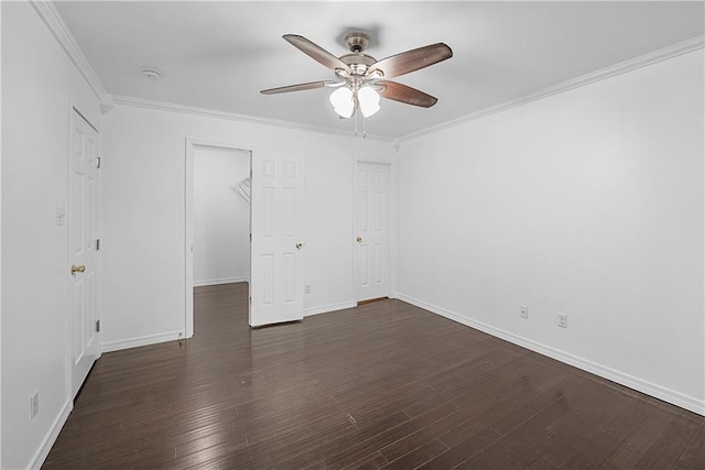 spare room with crown molding, dark hardwood / wood-style flooring, and ceiling fan