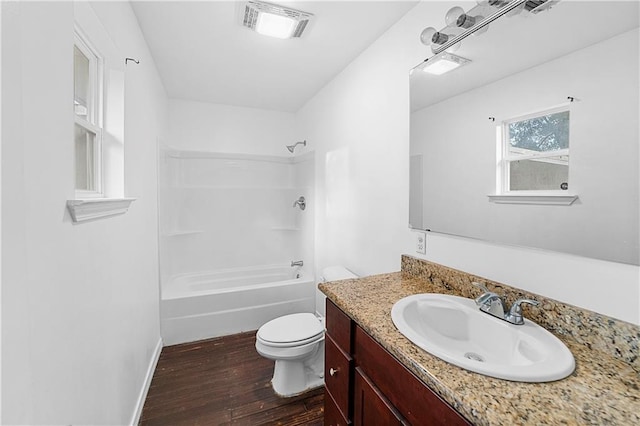 full bathroom with toilet, vanity, shower / bathtub combination, and hardwood / wood-style flooring