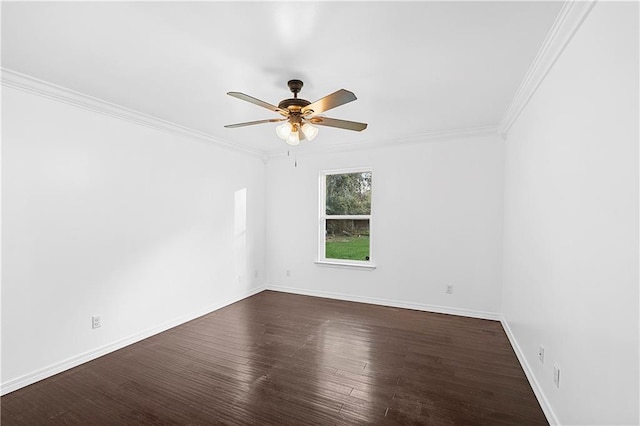 empty room featuring dark hardwood / wood-style floors, ceiling fan, and ornamental molding