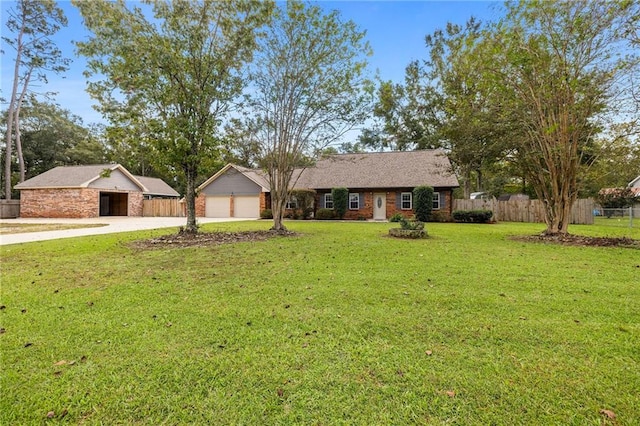 ranch-style house featuring a front yard and a garage