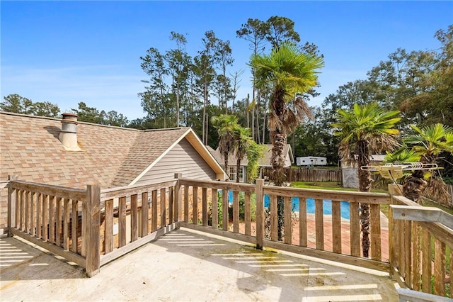 wooden terrace with a pool