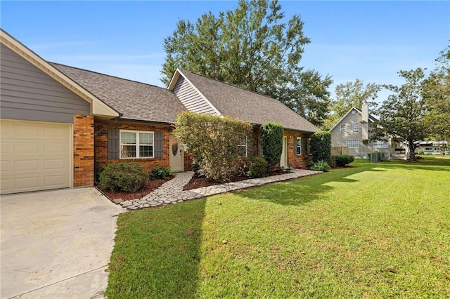 view of front of property featuring a garage and a front lawn