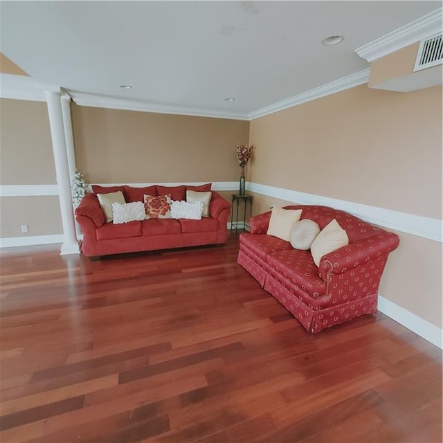 living room with hardwood / wood-style flooring and ornamental molding