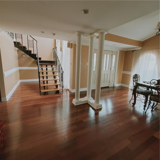 basement with dark hardwood / wood-style floors