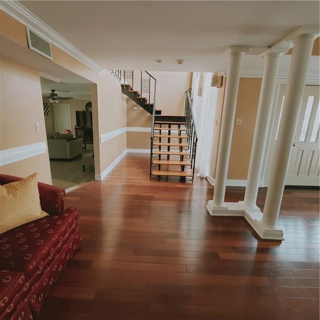 interior space featuring wood-type flooring and ornamental molding