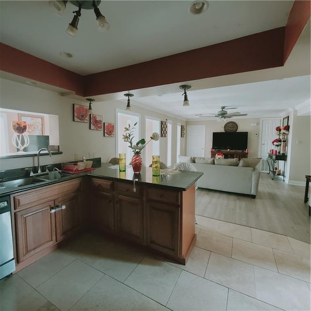 kitchen featuring kitchen peninsula, ceiling fan, sink, dishwasher, and light hardwood / wood-style floors