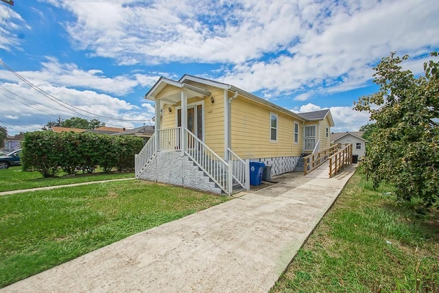 view of side of home featuring a yard