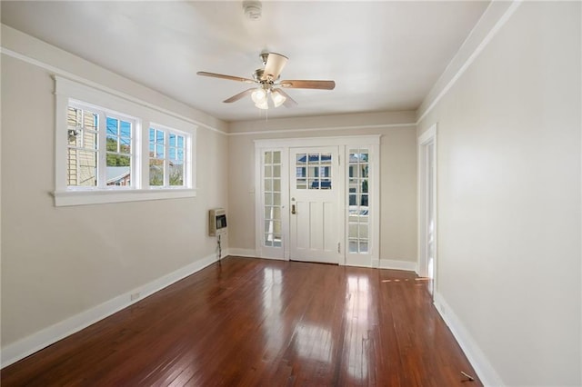 entryway featuring dark hardwood / wood-style flooring, heating unit, and ceiling fan