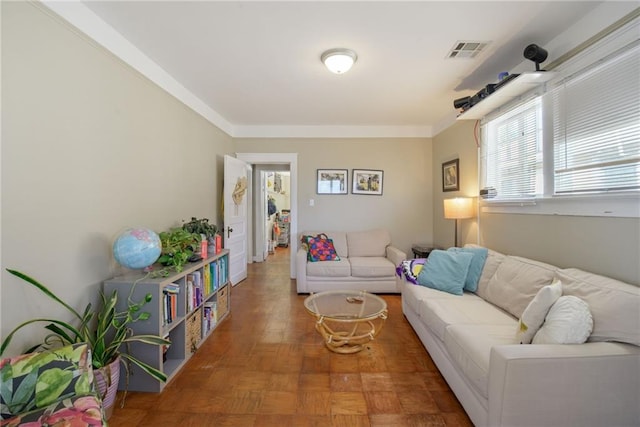 living room featuring parquet floors and crown molding