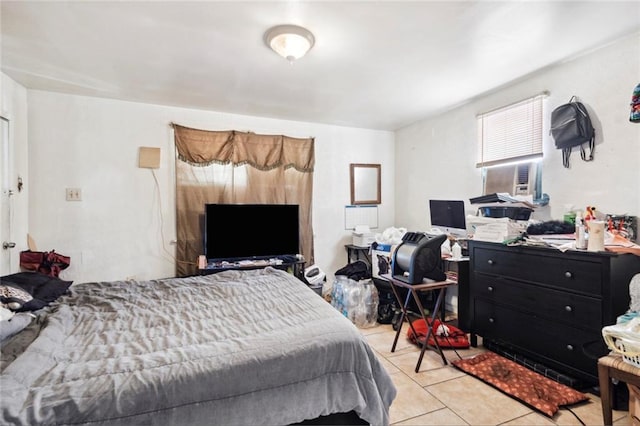 bedroom featuring cooling unit and light tile patterned flooring