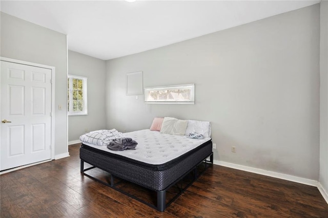 bedroom featuring dark wood-type flooring