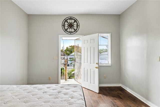 unfurnished bedroom featuring dark hardwood / wood-style floors