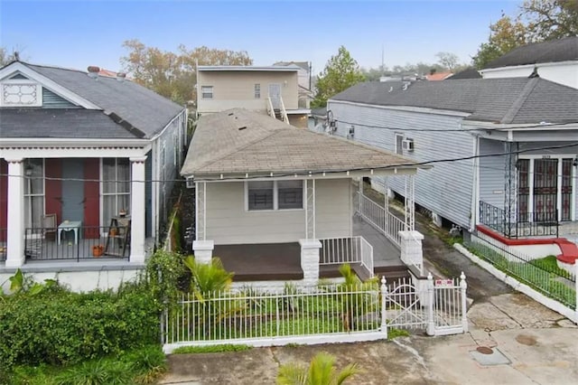 back of property featuring covered porch