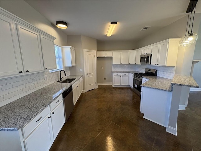 kitchen with light stone countertops, stainless steel appliances, sink, pendant lighting, and white cabinets