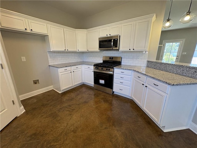 kitchen with decorative backsplash, light stone countertops, stainless steel appliances, white cabinets, and hanging light fixtures