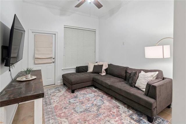 living room with ceiling fan and crown molding