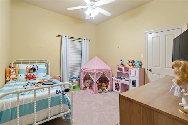 carpeted bedroom featuring ceiling fan