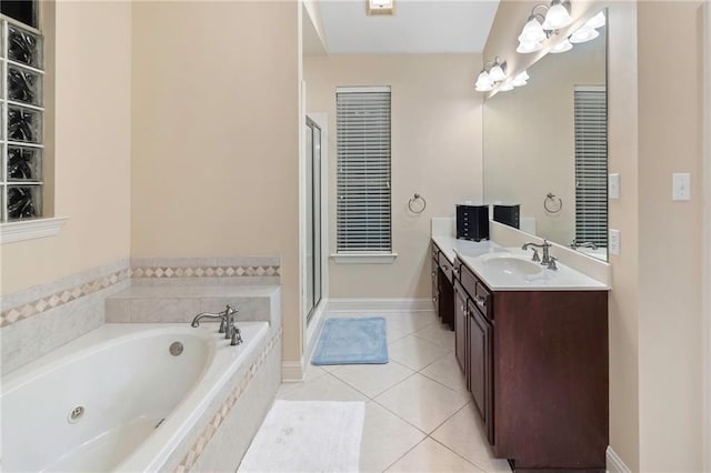 bathroom with tile patterned flooring, vanity, and separate shower and tub