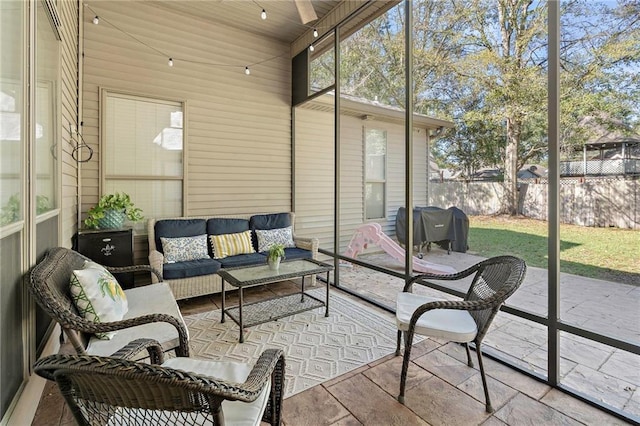 sunroom featuring lofted ceiling and wood ceiling