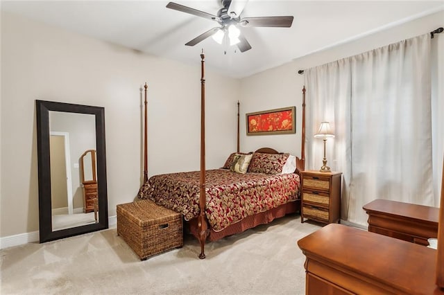 bedroom featuring light carpet and ceiling fan