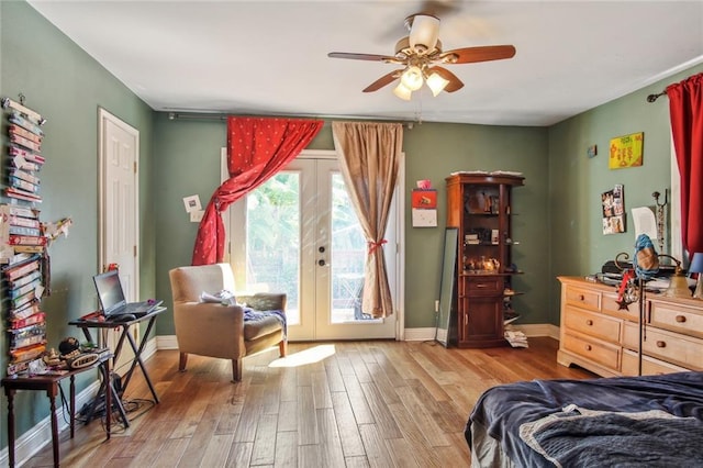 1311 Frenchmen St, New Orleans, LA 70116 - bedroom featuring access to exterior, wood finished floors, french doors, baseboards, and ceiling fan