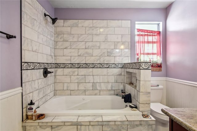 1311 Frenchmen St, New Orleans, LA 70116 - full bathroom with toilet, wainscoting, and tiled shower / bath