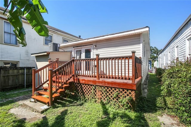 1311 Frenchmen St, New Orleans, LA 70116 - rear view of property featuring a wooden deck and cooling unit